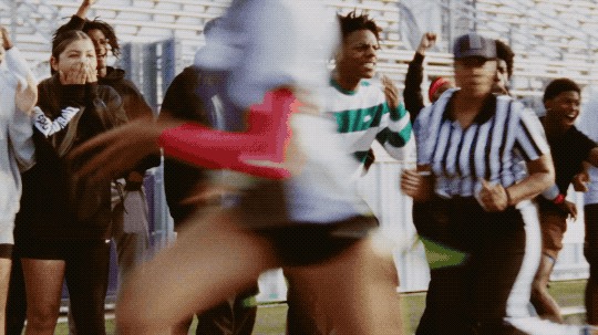 NFL Flag Football player throwing on a field